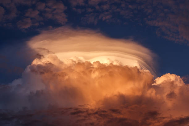 Stormy clouds. Cumulonimbus in sunset Cumulonimbus during sunset. Top of cumulus cloud. Dramatic sky before storm stratosphere meteorology climate air stock pictures, royalty-free photos & images