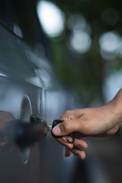 istock person opening the car with the key 1334161347