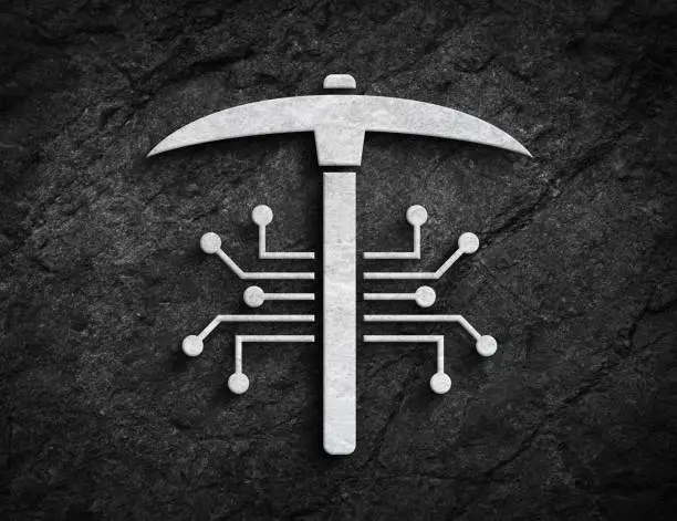 Photo of Crypto mining circuit and pickaxe symbol stone wall background