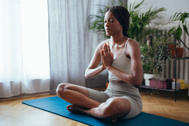 istock Young Woman Practicing Yoga in the Morning 1334163295