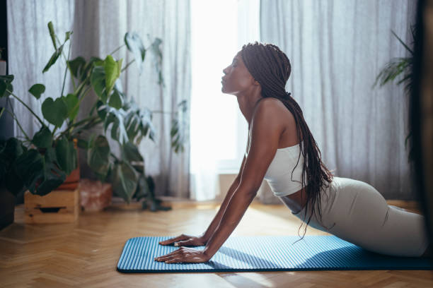 istock Young Woman Practicing Yoga in the Morning 1334163318