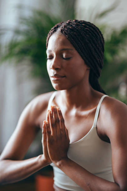 istock Young Woman Practicing Yoga in the Morning 1334164383
