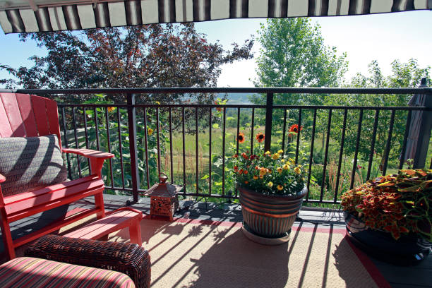 istock Stylish Garden Deck Under A Striped Awning 1334166943