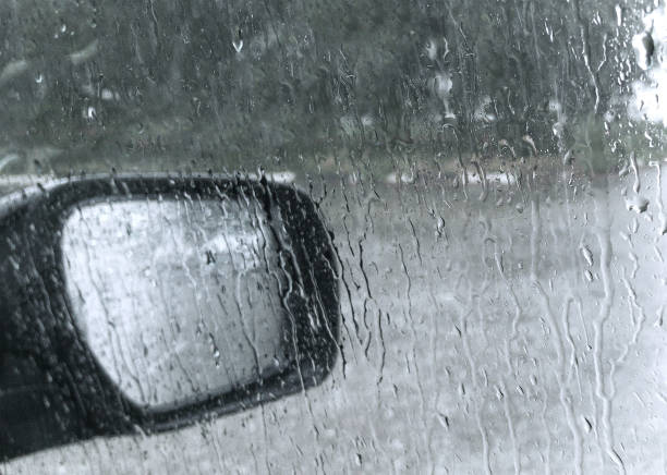 istock car rear-view mirror at rain shower 1334175543