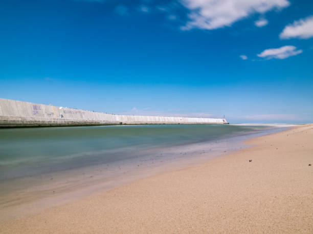 istock Clouds over sandy beach in Mielno, Poland 1334176242