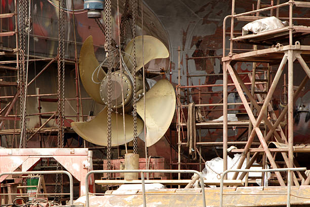 Shot of the rear haul of a freight ship jacked up in dry dock vor overhaul