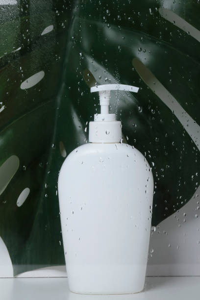 istock Soap bottle behind  wet glass 1334178101