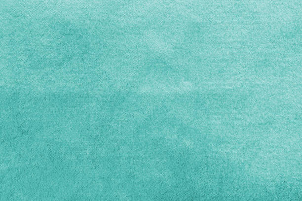 fondo de terciopelo azul azul azulado o textura de franela de terciopelo verde turquesa hecha de algodón o lana con tela de satén aterciopelado suave y esponjoso material de tela de color metálico - felt textured textured effect textile fotografías e imágenes de stock