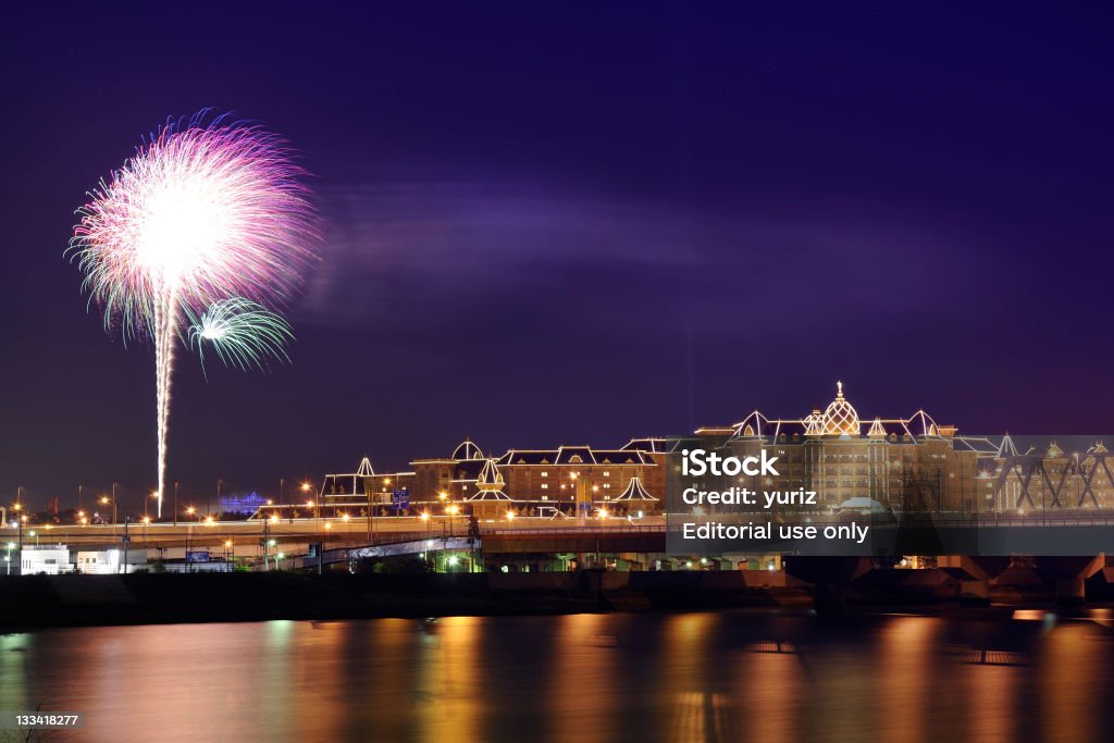 Tokyo Disneyland Tokyo, Japan -June 06, 2008 : night-time distant view to the  Famous Tokyo Disneyland during everyday fireworks. Amusement Park Stock Photo