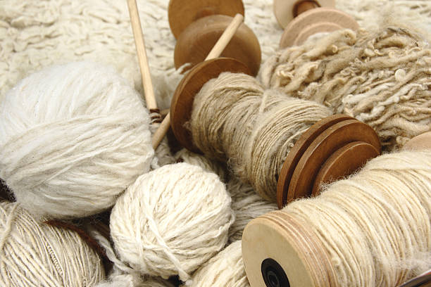 Natural wool yarns Different types of spun yarn a natural spindle stock pictures, royalty-free photos & images