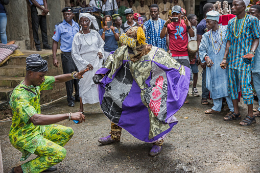 A man dancing with Egungun (masquerade) during the Osun Annual festival in Osogbo. Shot on 19th August 2016.