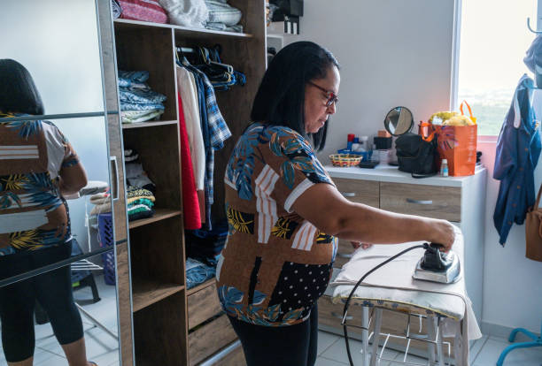 istock Brazilian woman ironing 1334193205