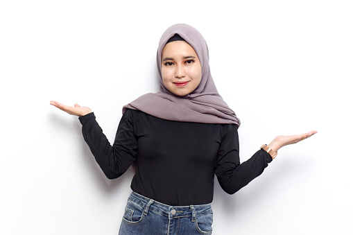 Indonesian woman wearing hijab, Black Shirt And Jeans Doing some pose isolated on white background, Copy space for advertising