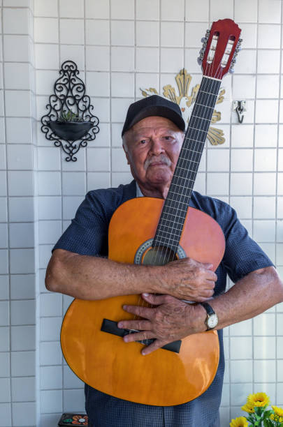 istock Senior man playing  a guitar 1334195512