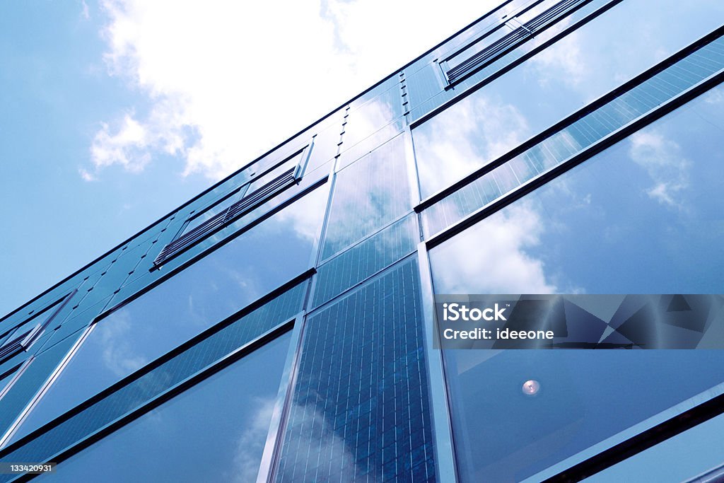 Solar blue Innovative Vertical Photovoltaik facade on building produces energy in contemporary architecture Solar Power Station Stock Photo