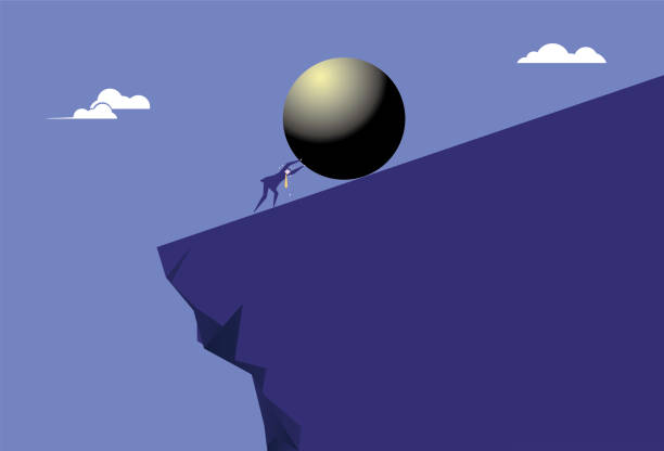istock The business man pushes the iron ball hard on the cliff 1334210564