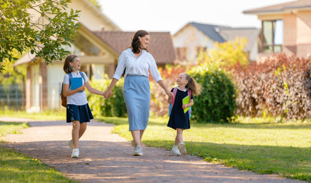 istock Parent and pupils going to school 1334213392