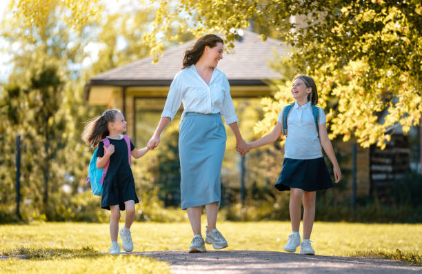 istock Parent and pupils going to school 1334213425