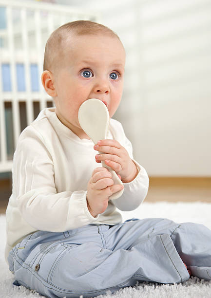 Adorable Baby Boy With Hairbrush stock photo
