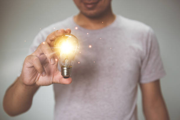 istock Hand holding light bulb. idea with innovation and inspiration.  innovative technology and solution creative business design concept. 1334220767