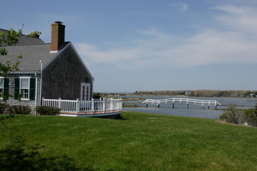 Sweet little cottage next to a saltwater pond with foot bridge at the Cape Cod MA
