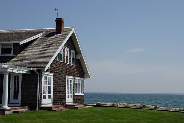 Seaside Cape Cute traditional Cape Building on the coast of Cape Cod cape cod stock pictures, royalty-free photos & images