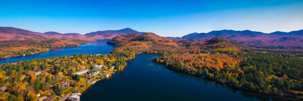 aerial view of lake placid mountains with autumn fall colors in adirondacks, new york, usa - new york canyon imagens e fotografias de stock