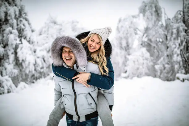 Photo of Happy couple on a snowy day