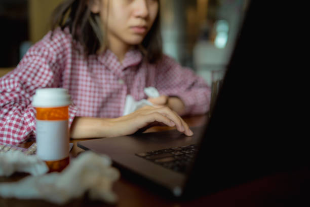 istock Woman suffering from the flu is working hard. 1334227025