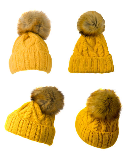 istock Women's knitted hat isolated on white background.hat with pompon.yellow hat 1334230005