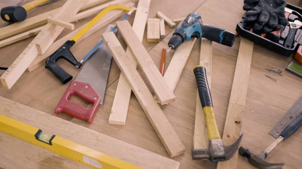 Carpenters tools on wooden background stock photo