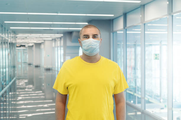 istock Man in protective medicine mask in airport 1334235036