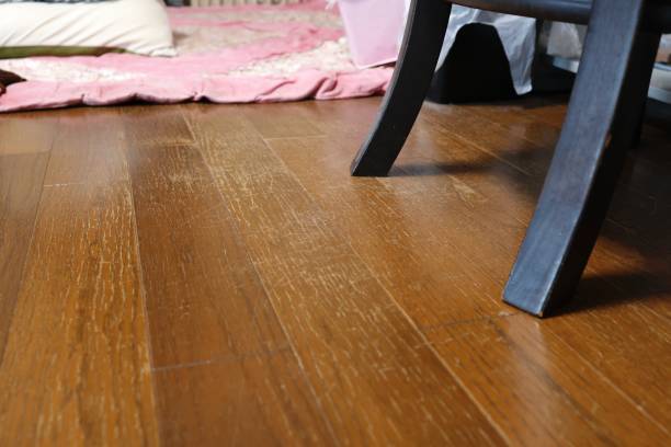istock The floor is damaged because I dragged the chair 1334236019