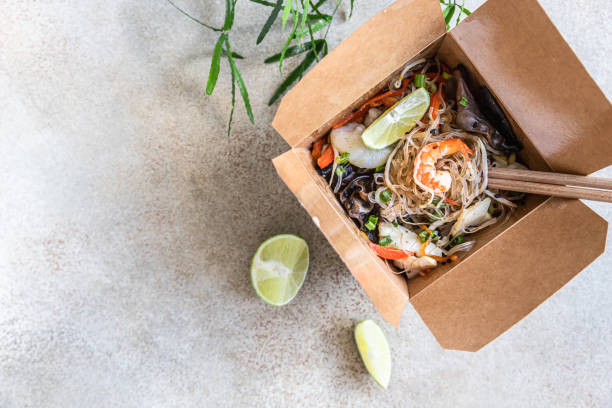 asian glass noodles with different types of seafood, vegetables and shiitake mushroom in disposable box. traditional asian takeaway food. top view. - prepared shrimp prawn seafood salad imagens e fotografias de stock