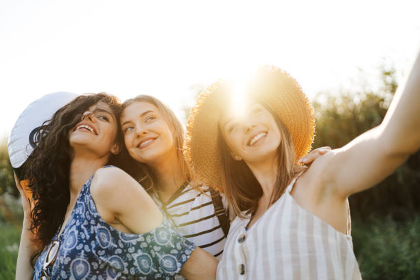 istock Girlfriends taking selfie in nature 1334240731