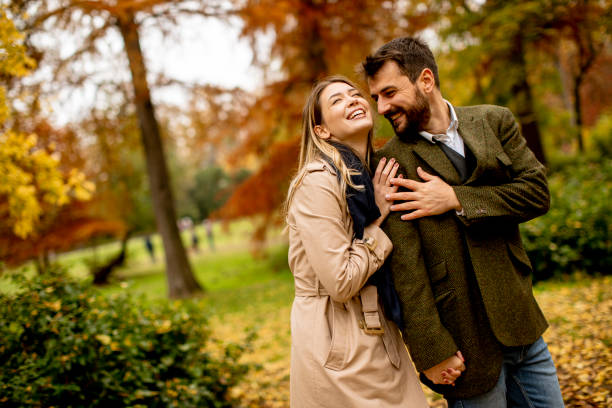 istock Young couple in the autumn park 1334241762