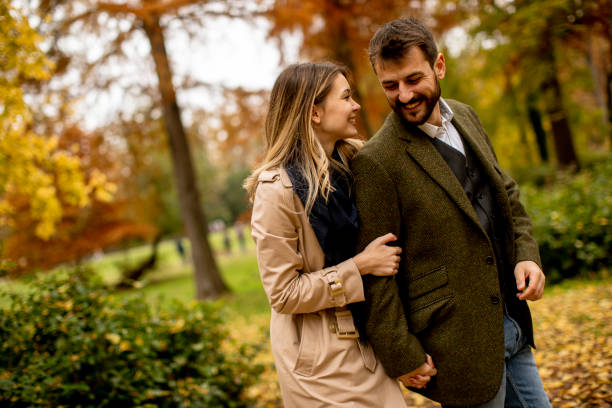 istock Young couple in the autumn park 1334241767