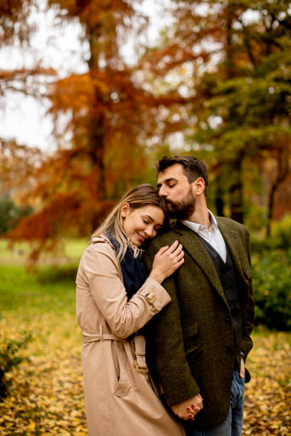 istock Young couple in the autumn park 1334241803