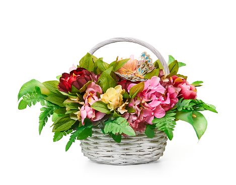 Flower arrangement in a vase in the form of an basket. Composition