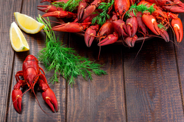 istock Red crayfishes on a plate served with dill and lemon 1334243485