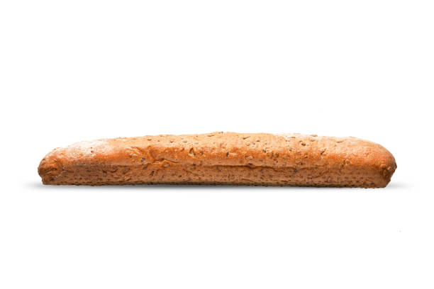 français baguette brune isolée sur fond blanc. délicieux pain frais pour les sandwichs, - brown bread bread wheat bakery photos et images de collection