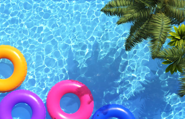 istock Beautiful swimming pool with palm trees. Pool party, summer background. 1334246174