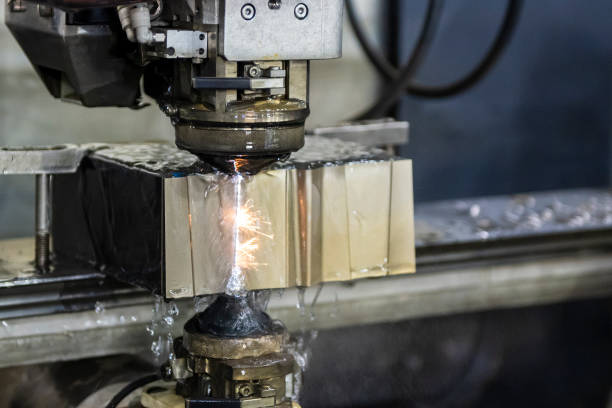 istock The wire EDM machine cutting the insert mold parts. 1334248382