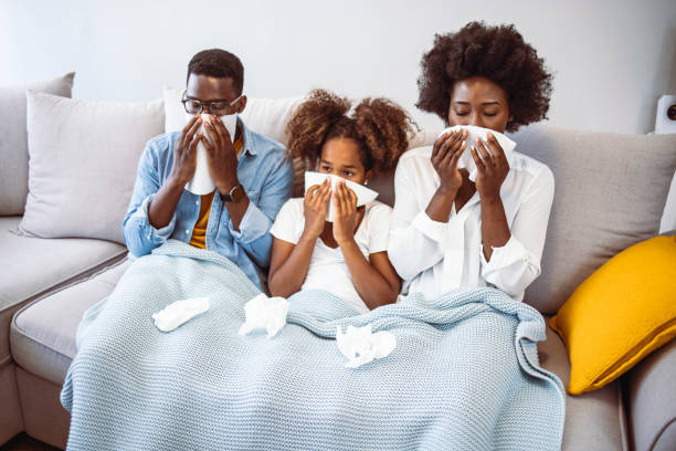 istock Family suffering from cold in bed at home. 1334249946