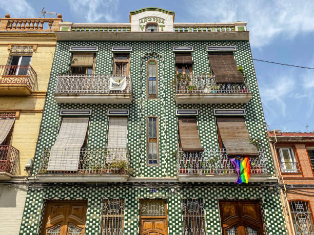 Traditional architecture in El Cabanyal district in Valencia, Spain Valencia, Spain - August 9, 2021: Low angle view of old building dated from 1934 in El Cabanyal district. The tiles covering the whole facade are a traditional custom in the Valencian Community 1934 stock pictures, royalty-free photos & images