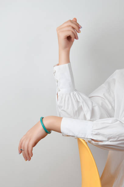 istock Manicured womans hands with trendy minimal jewelry 1334252322