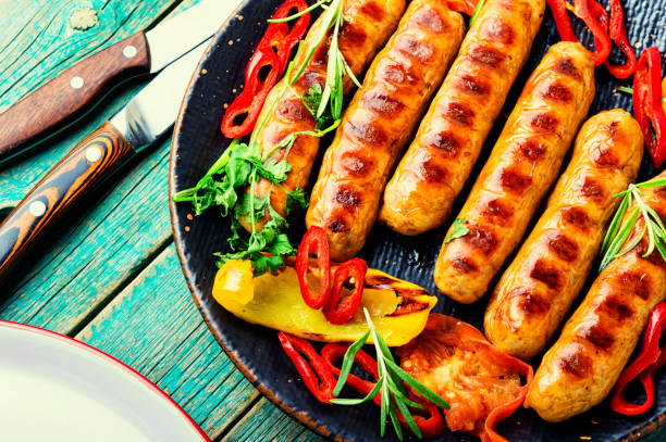 istock Fried sausages with bell pepper 1334255147