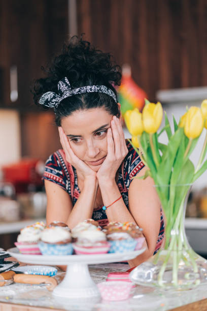 istock Sad mid adult woman having relationship problems, standing in kitchen 1334256692