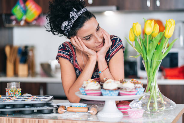 istock Sad mid adult woman having relationship problems, standing in kitchen 1334256693