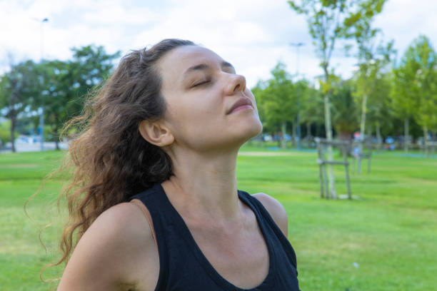 istock Woman breathing fresh air outdoors in summer 1334257944